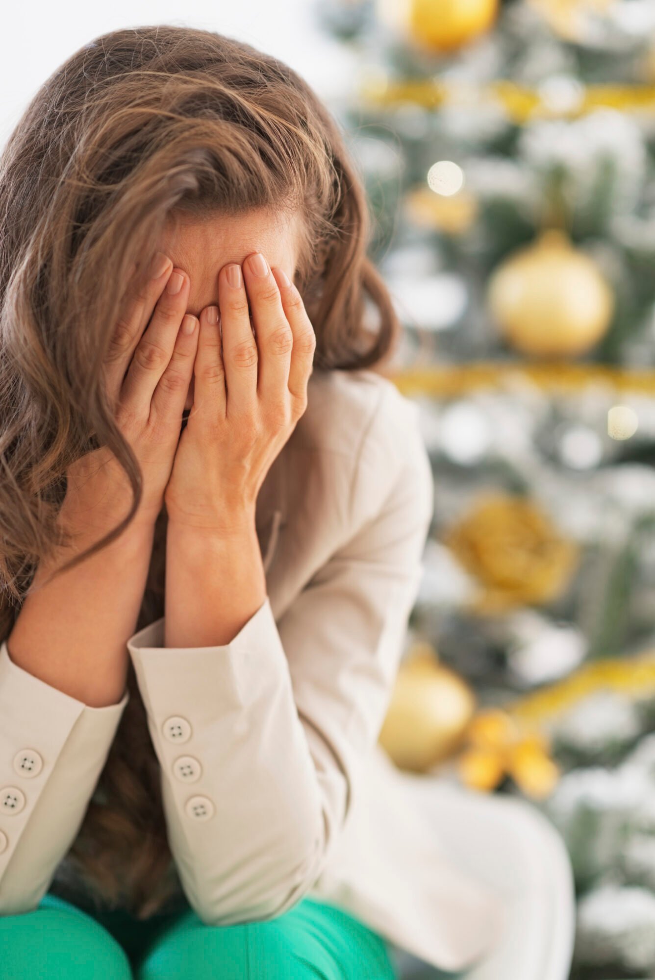 Stressed young woman near christmas tree Stressed young woman near christmas tree